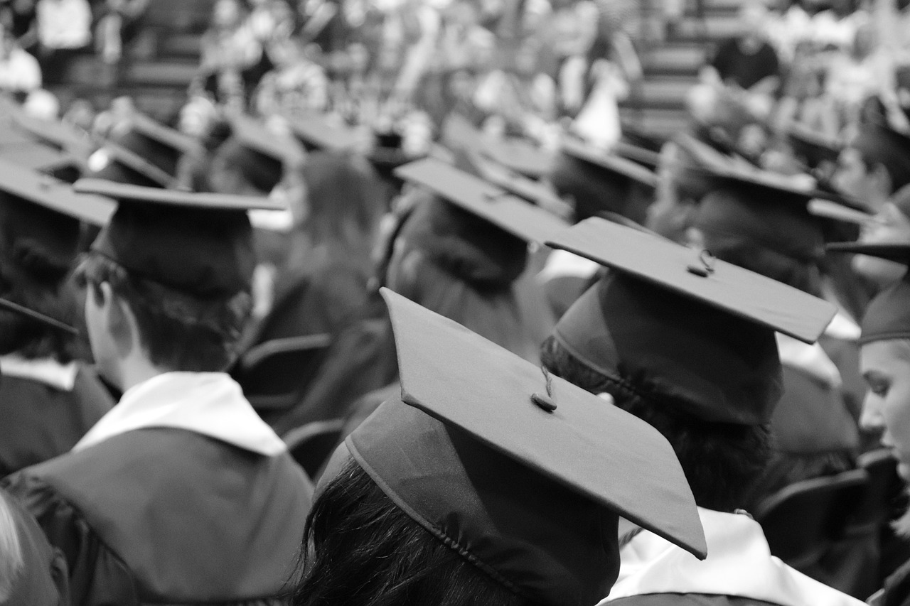 Image of black and white graduation caps