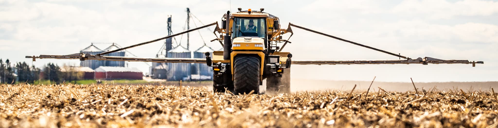 Sprayer driving through a field